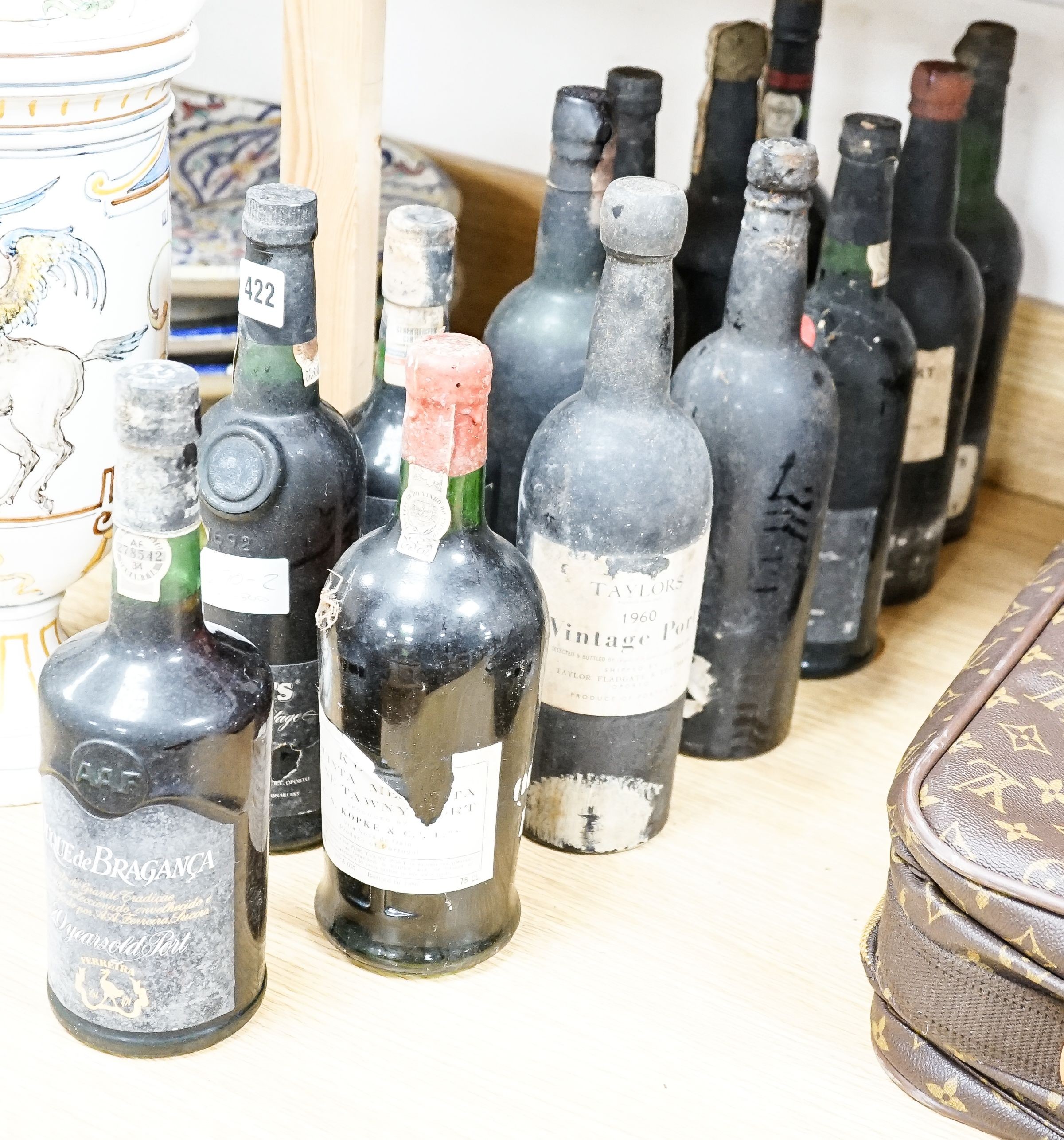 13 various bottles of port including Taylor’s 1976, Taylor’s 1960, Boplaas 1987, Cockburns 1963 etc.